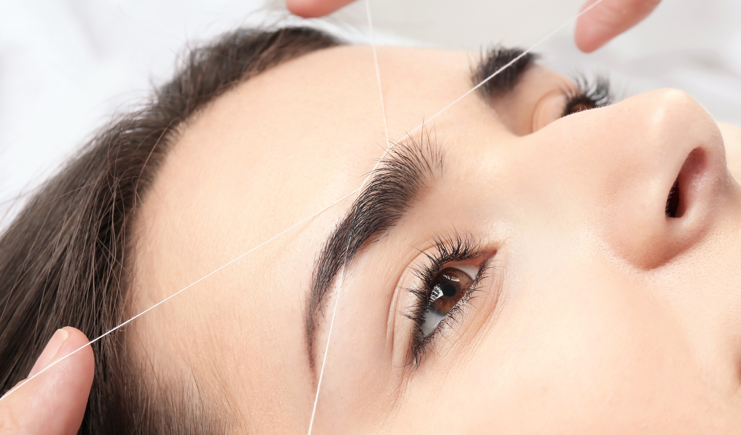 Eyebrow threading close-up